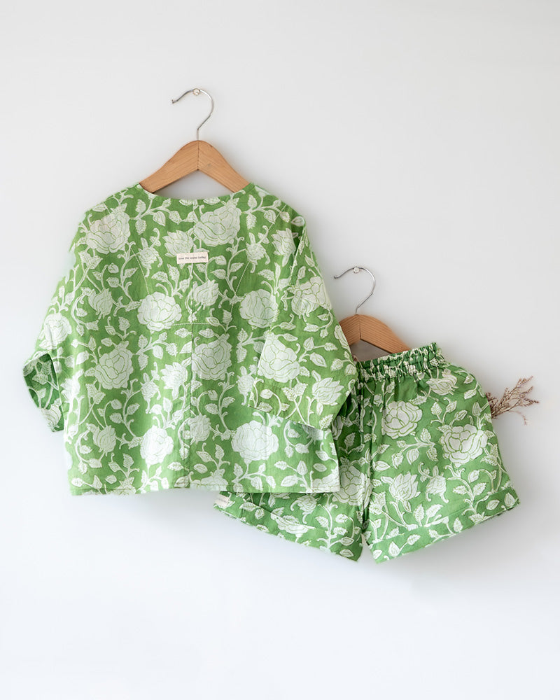 Unisex vintage print forest green colour floral kimono shirt and shorts coord set for girls and boys in breathable mulmul cotton that is hand block printed in Jaipur. Shorts have a soft elastic waist, coconut shell buttons and is handmade in India