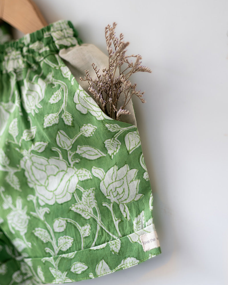 Unisex vintage print forest green colour floral kimono shirt and shorts coord set for girls and boys in breathable mulmul cotton that is hand block printed in Jaipur. Shorts have a soft elastic waist, coconut shell buttons and is handmade in India