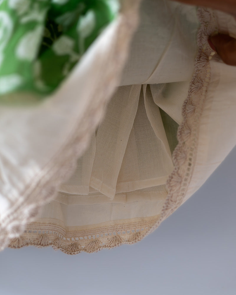 Sleeveless mul mul cotton layered pinafore style cute summer frock for girls in forest green and white colour. Vintage crochet detailing at the bottom of the dress.