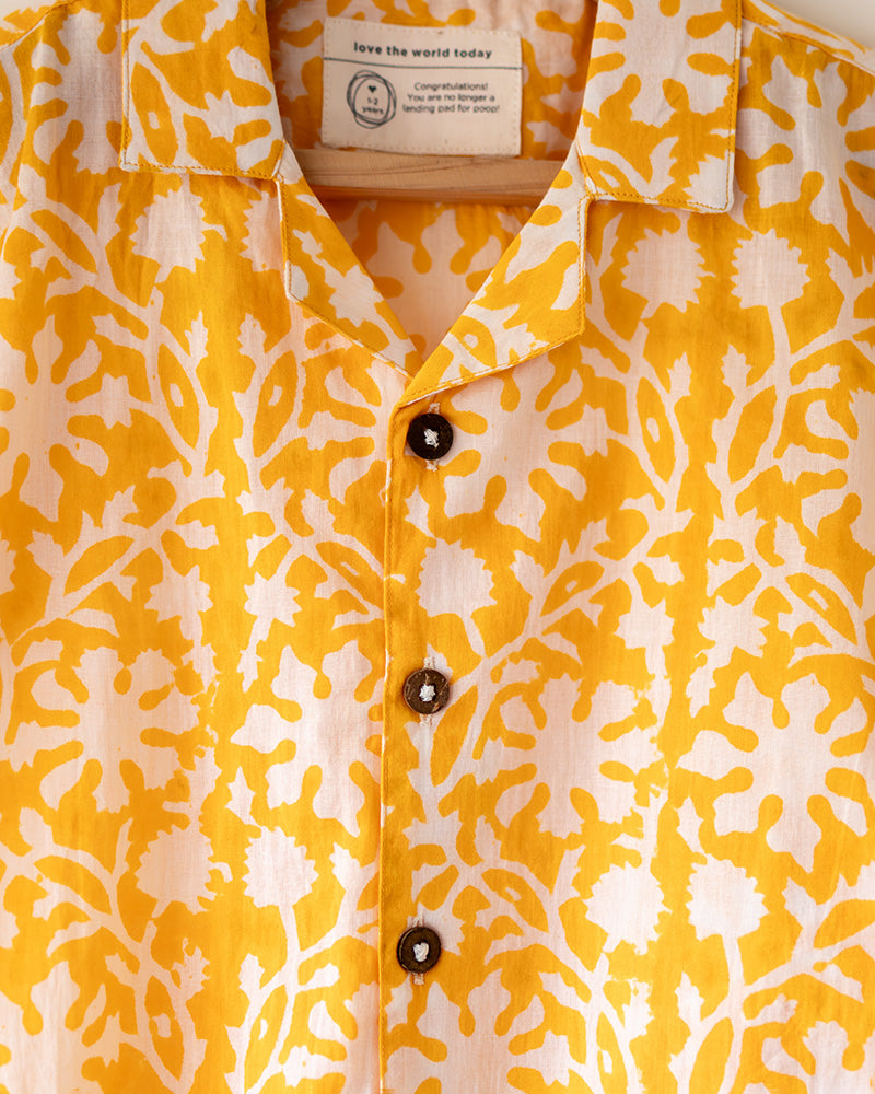 A relaxed half sleeve yellow shirt and shorts coord. Handblock printed cotton shirt made with 100% soft and breathable mal cotton.
Shorts are made with 100% cambric cotton. Soft elastication on waist along with adjustable drawstring
Handy pockets in shorts. Natural coconut shell buttons.