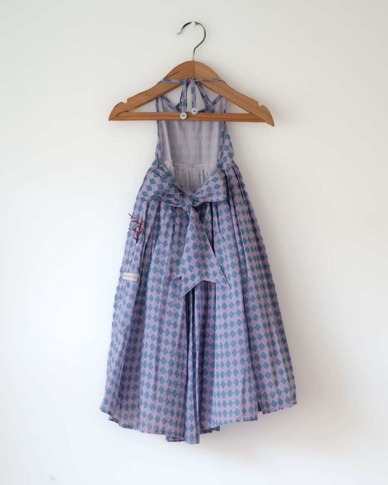 A deep purple geometric Rhombus print halter neck maxi dress. Has back tie ups.