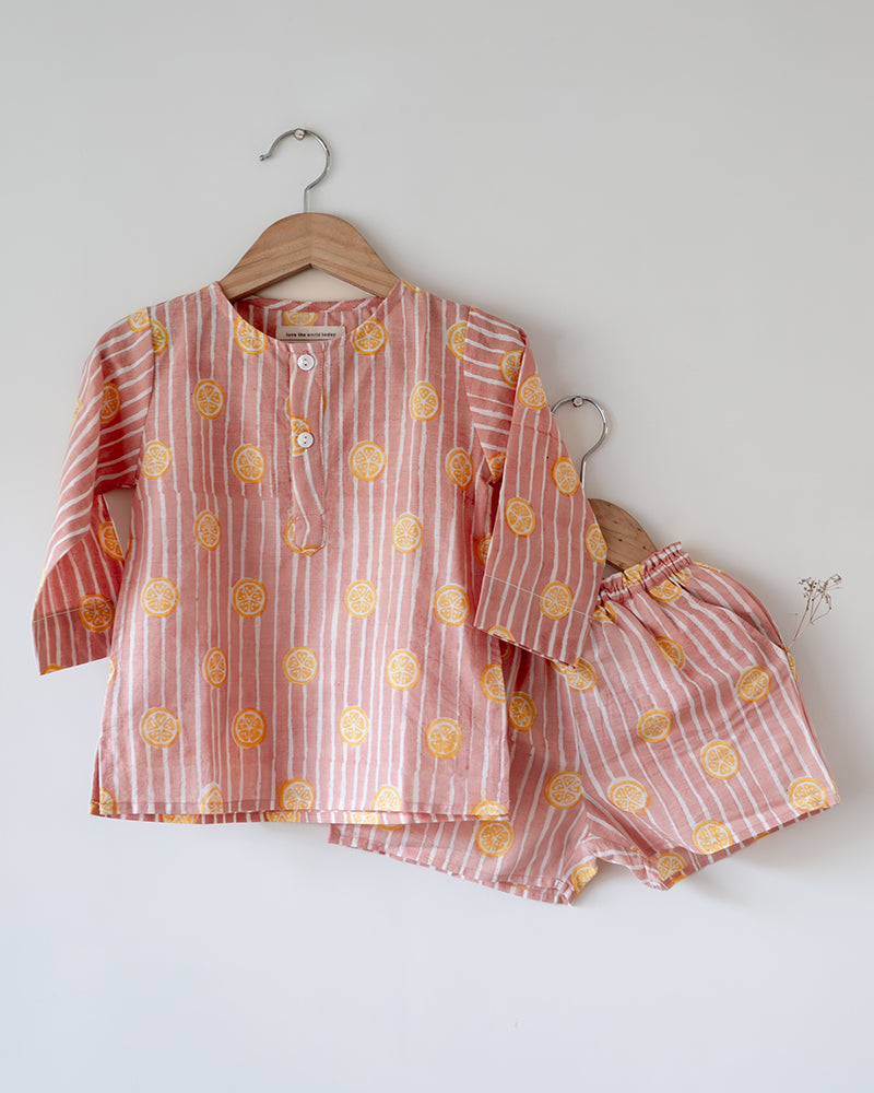 Unisex kids cotton kurta and grey shorts co ord set. Striped kurta and Shorts hand block printed by artisans in Jaipur, Rajasthan. Kurta has shell buttons and small pockets.