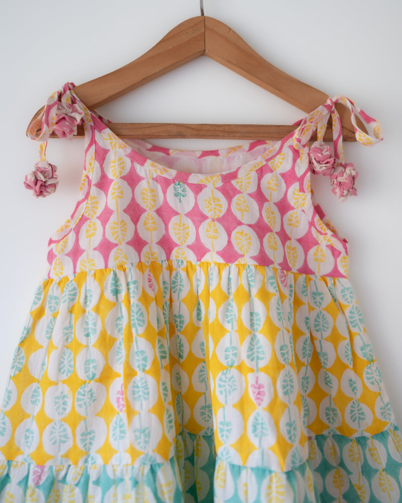 Hand block printed multi color tiered dress with shoulder tie ups and tassels