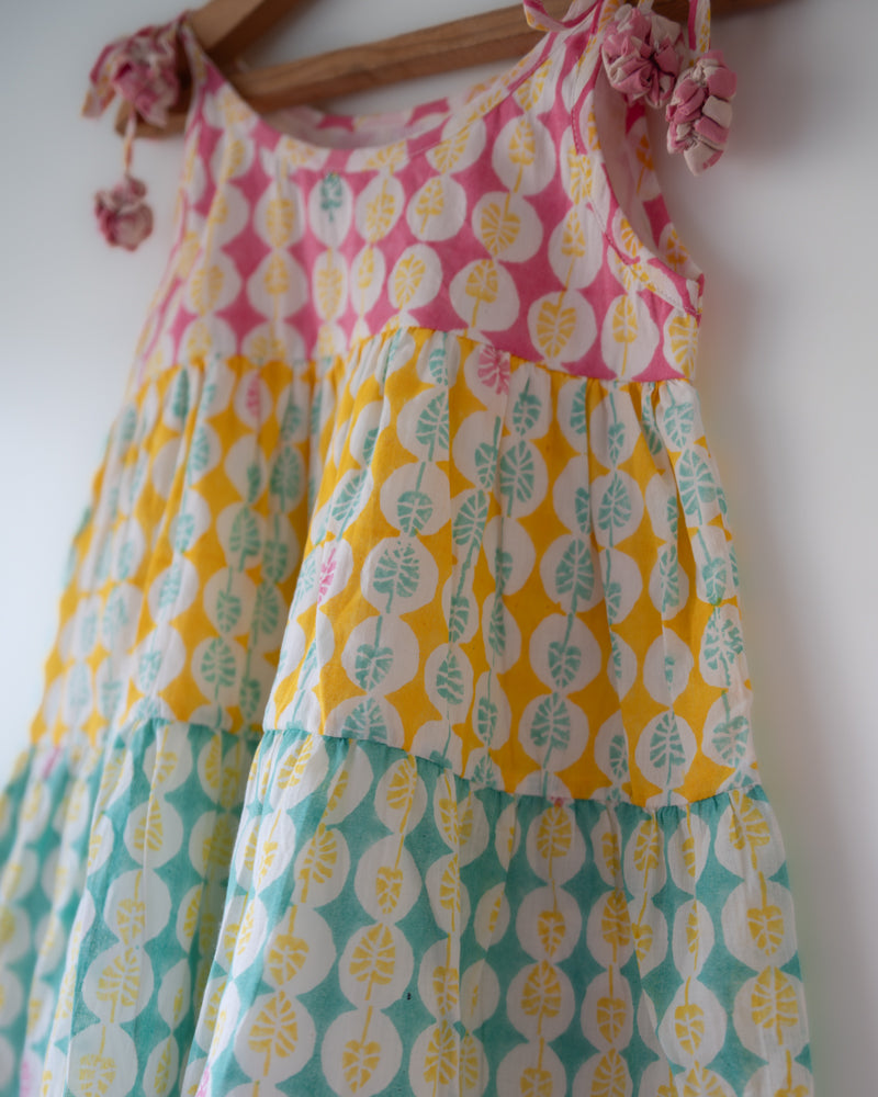 Hand block printed multi color tiered dress with shoulder tie ups and tassels
