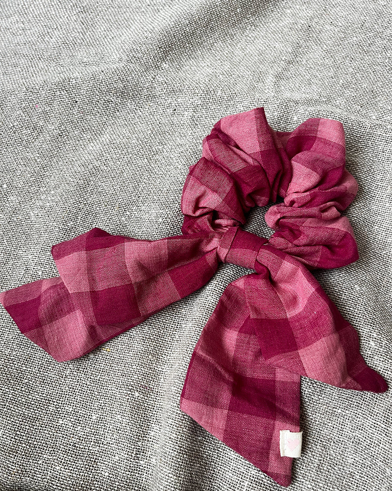 Pink checkered scrunchie with pink checkered bow.