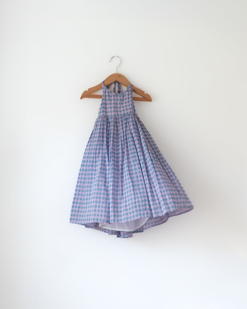 A deep purple geometric Rhombus print halter neck maxi dress. Has back tie ups.