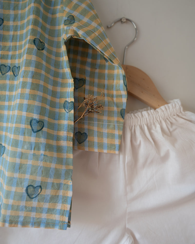 Unisex GOTS certified organic cotton pajama paired with blue checkered hand block printed kurta with pockets and natural shell buttons. Pajama has elastication at waist for ease of wear. Grandpa style kurta pajama set.