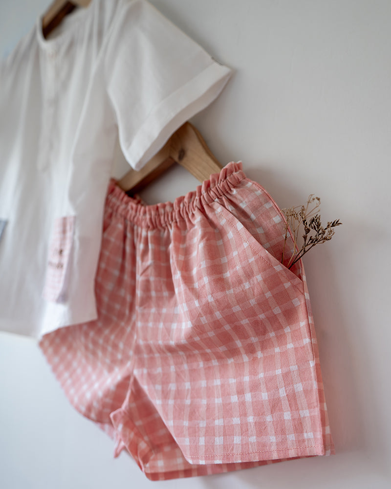 100% Cotton checkered Shorts hand block printed by artisans in Jaipur, Rajasthan. Has soft elastication at waist for ease of wear. Comes with small pockets.