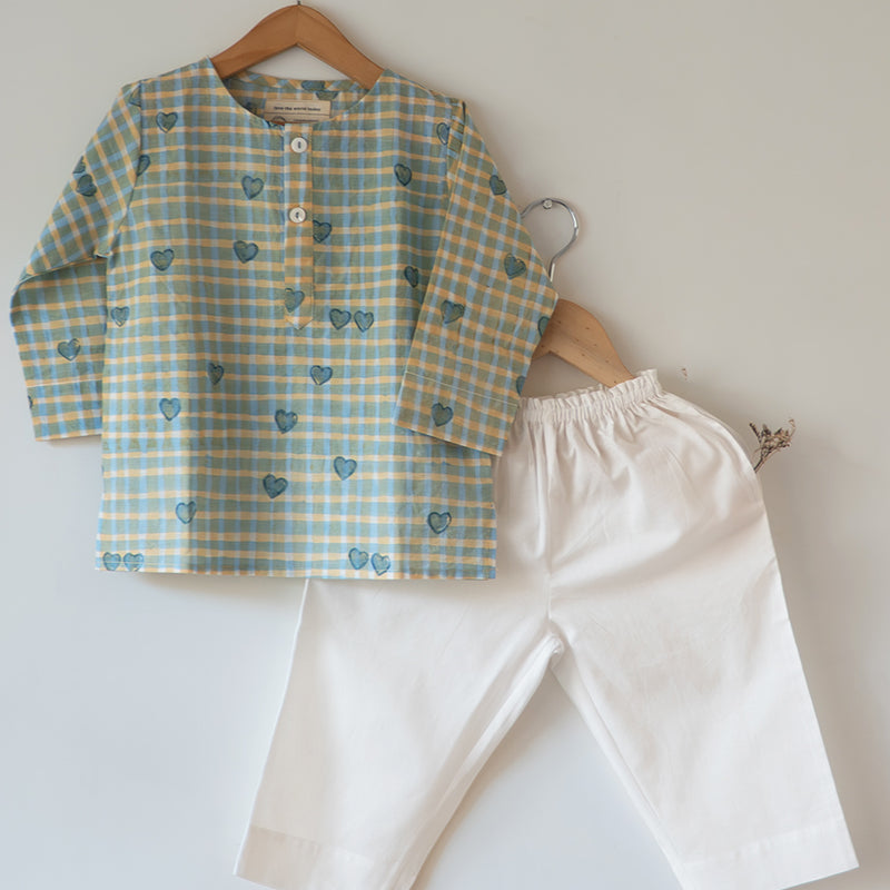 Unisex kids GOTS certified organic cotton pajama paired with blue checkered hand block printed kurta with pockets and natural shell buttons. Pajama has elastication at waist for ease of wear. Grandpa style kurta pajama set.
