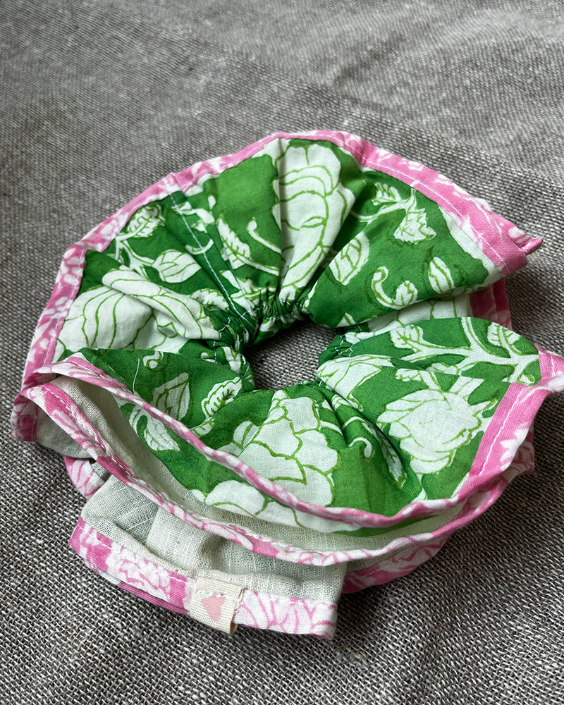 Green floral scrunchie with pink piping.