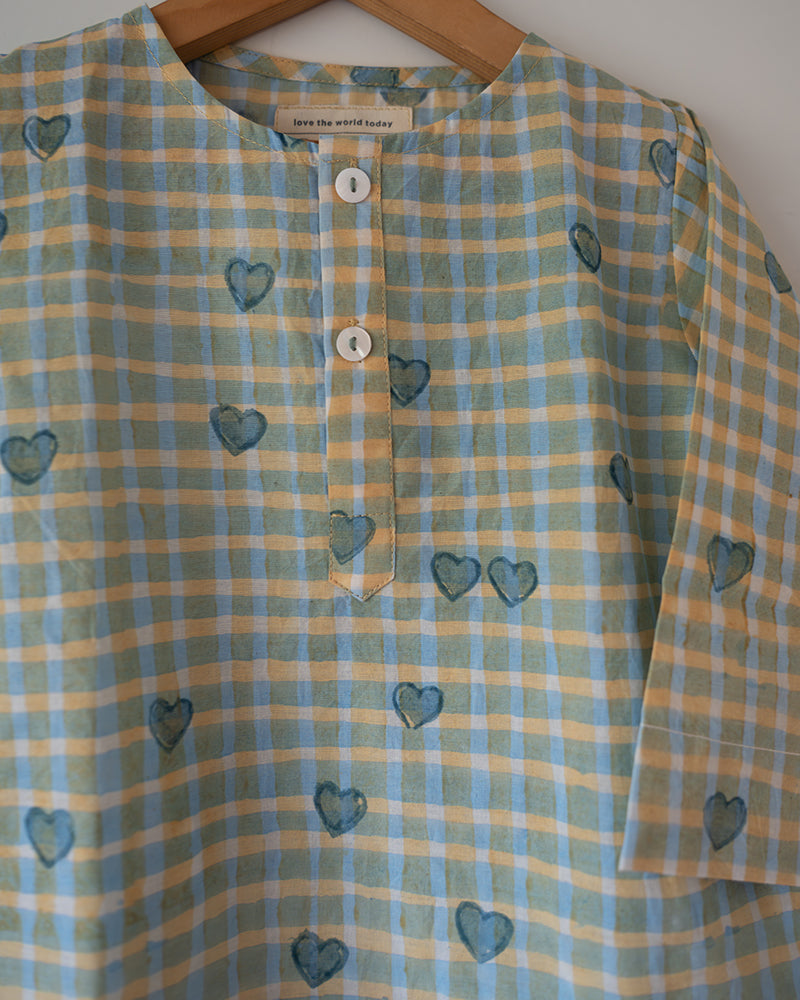 Unisex GOTS certified organic cotton pajama paired with blue checkered hand block printed kurta with pockets and natural shell buttons.