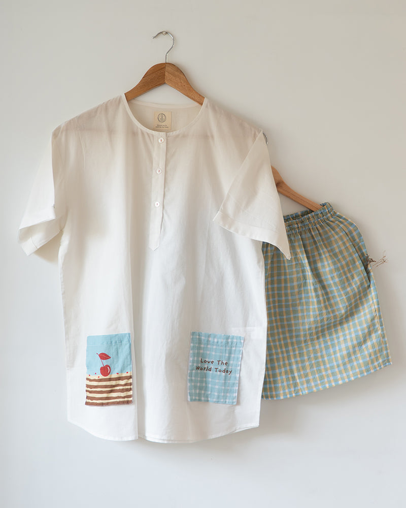 Unisex adults Gots certified organic cotton kurta and grey shorts co ord set. Kurta pockets and Shorts hand block printed by artisans in Jaipur, Rajasthan. Kurta has shell buttons and small pockets. Shorts have soft elastication and drawstring at waist for ease of wear.