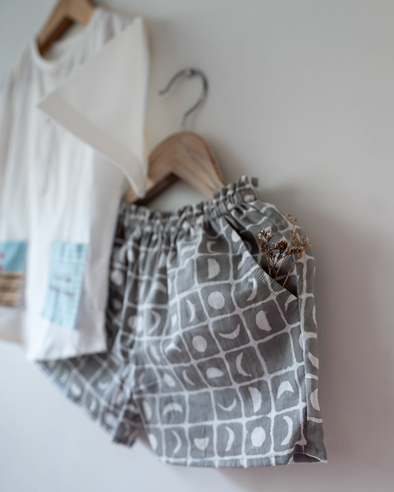 100% Cotton checkered Shorts hand block printed by artisans in Jaipur, Rajasthan. Has soft elastication at waist for ease of wear. Comes with small pockets.