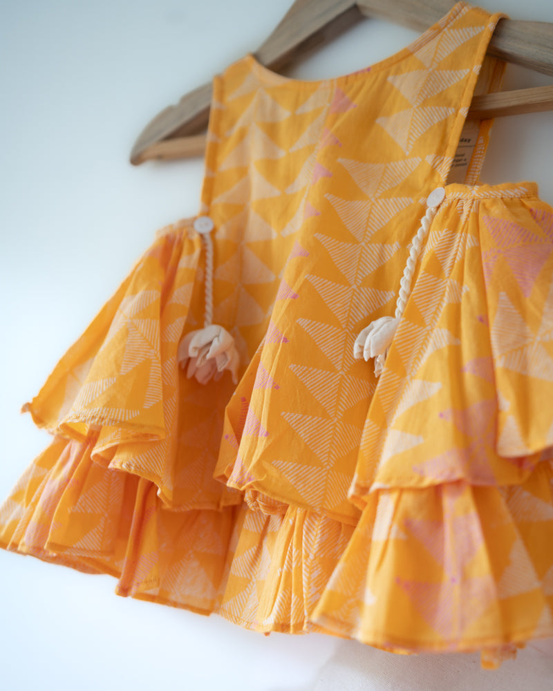 Hand block printed yellow top, Has tassels. A beautiful yellow chevron print.