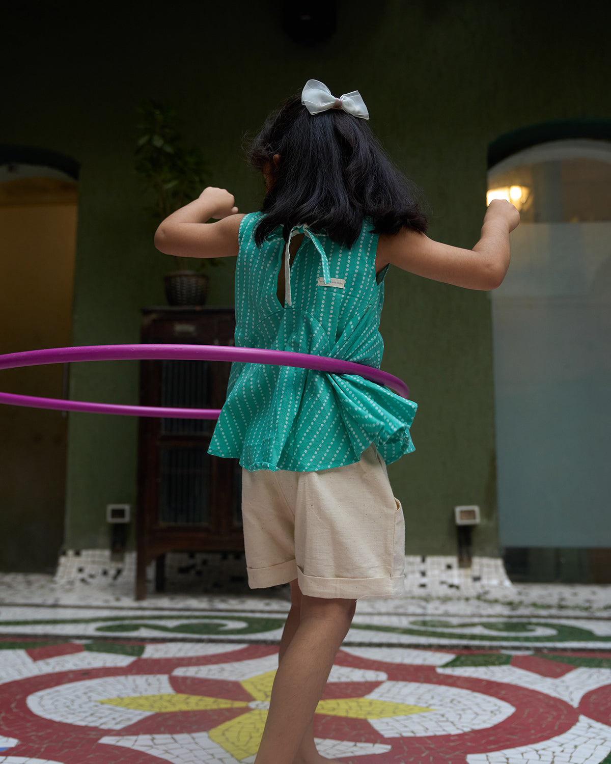 sleeveless-flared-girls-top-in-blue-with-white-dot-with-pockets