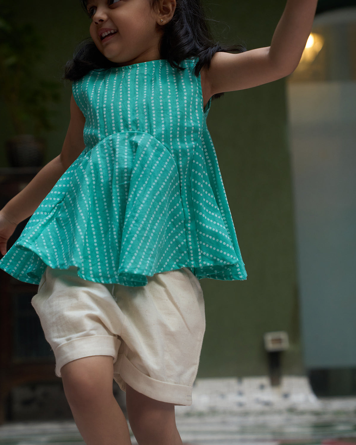 sleeveless-flared-girls-top-in-blue-with-white-dot-with-pockets