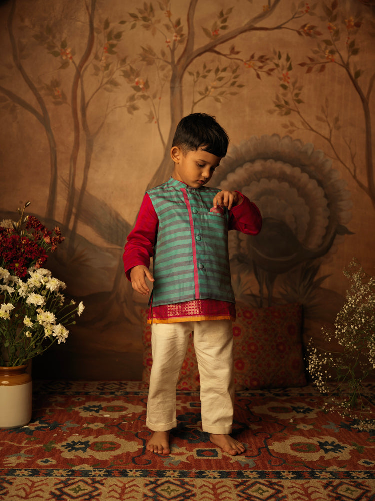 Teal Blue and grey striped Indian festive bandi nehru jacket made with Handwoven cotton silk. Perfect festive Kids silk ethnic wear. Paired with off white kora pants.