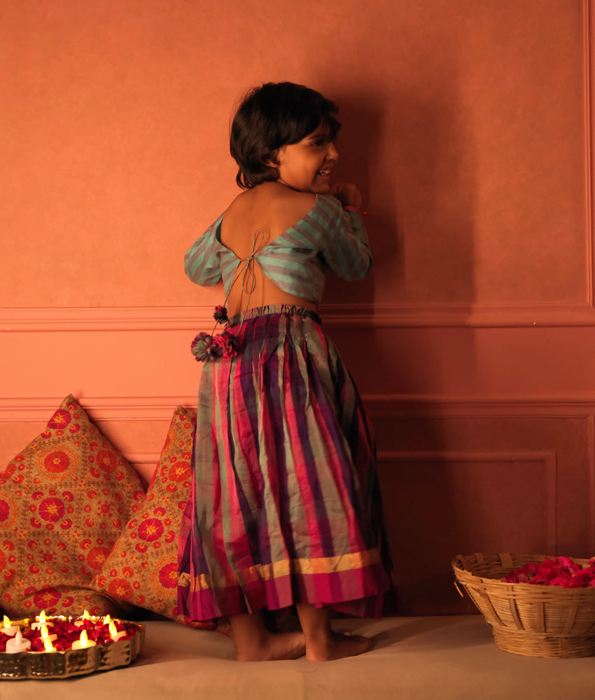 Light blue and grey striped full sleeve blouse with a deep purple, pink and grey checkered handwoven cotton silk lehenga. Perfect Kids ethnic outfits.