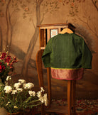 Green handwoven cotton silk infant Angrakha Kurta with traditional gold checks and a pink-gold woven border, festive ethnic wear for babies by Love The World Today.