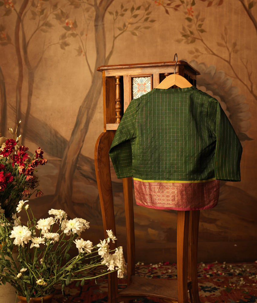 Green handwoven cotton silk infant Angrakha Kurta with traditional gold checks and a pink-gold woven border, festive ethnic wear for babies by Love The World Today.