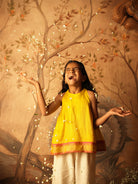 Yellow halter neck top and off white palazzo set. Made with handwoven cotton silk. Premium ethnic silk wear for kids.