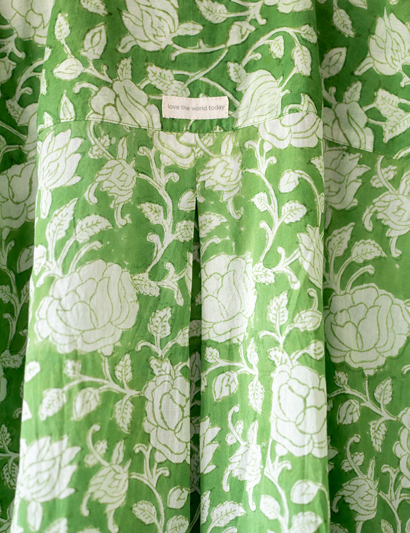 A high low stylish chinese collared shirt with cuff made in breathable mal cotton that can be paired with almost anything for hot summer days. The shirt has a lovely floral hand block print design with natural coconut shell buttons.