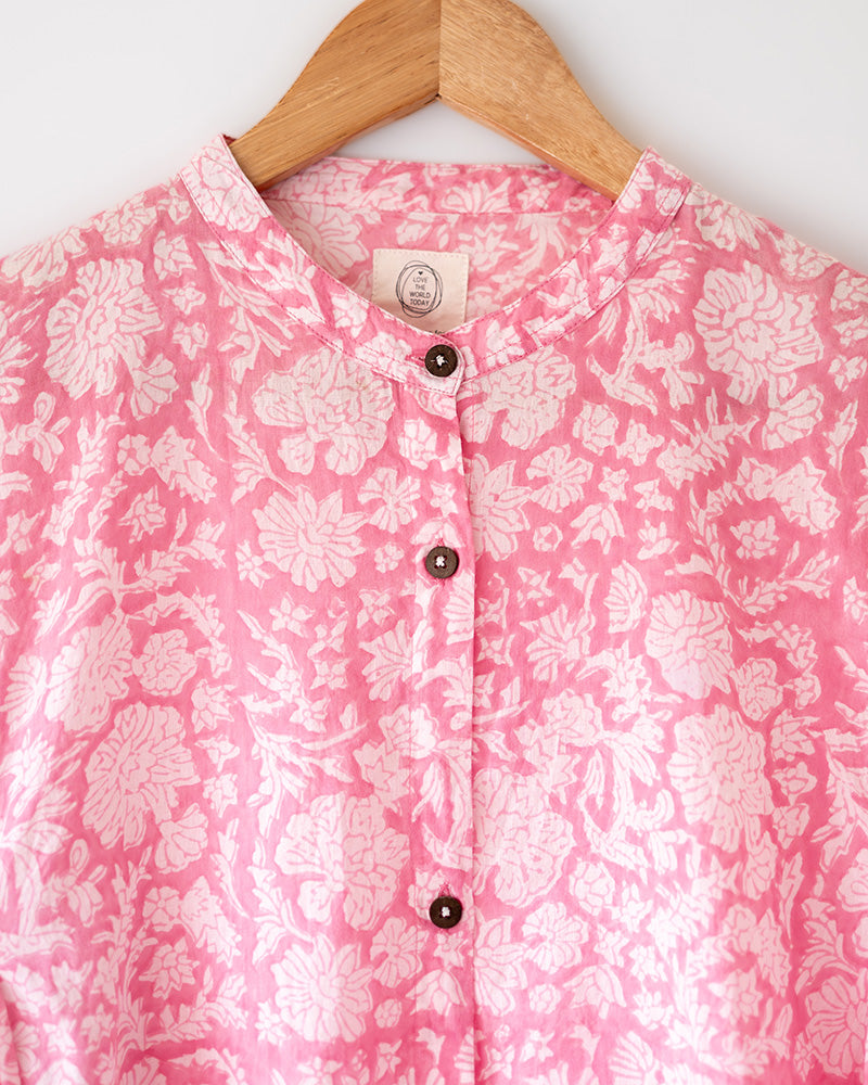 Voluminous kedia style top with a beautiful bohemian feel to it. It is a versatile top that can be worn with white pants, shorts, skirt or denims or even styled as a blouse with a saree. Even as a jacket to add a voluminous layer of style to any ensemble. Made in pink floral handblock print mal mal cotton. 