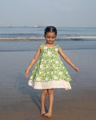 Sleeveless mul mul cotton layered pinafore style cute summer frock for girls in forest green and white colour. Vintage crochet detailing at the bottom of the dress. 