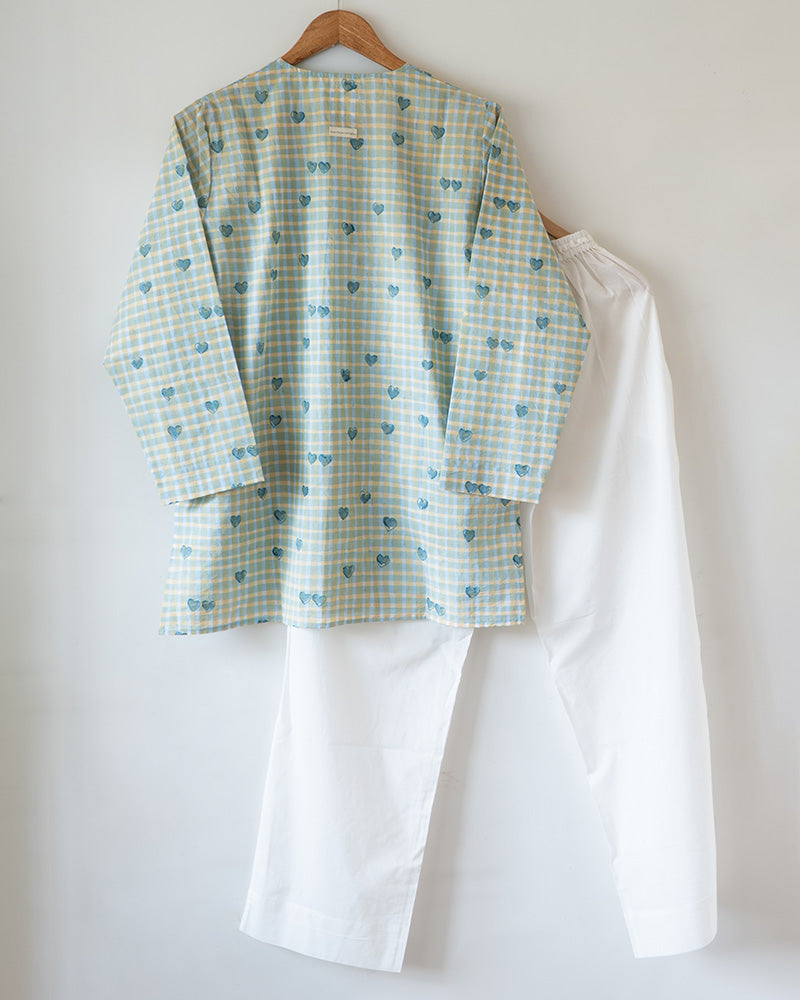 Unisex adults GOTS certified organic cotton pajama paired with blue checkered hand block printed kurta with pockets and natural shell buttons. Pajama has elastication at waist for ease of wear. Grandpa style kurta pajama set.