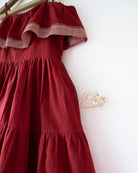 Handwoven cotton red tiered maxi dress with shoulder straps and pockets.