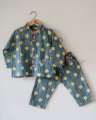 Unisex kids cotton striped shirt and pajama hand block printed with pockets and natural shell buttons. Pajama has elastication & drawstring at waist for ease of wear. Kimono style shirt & pajama set.