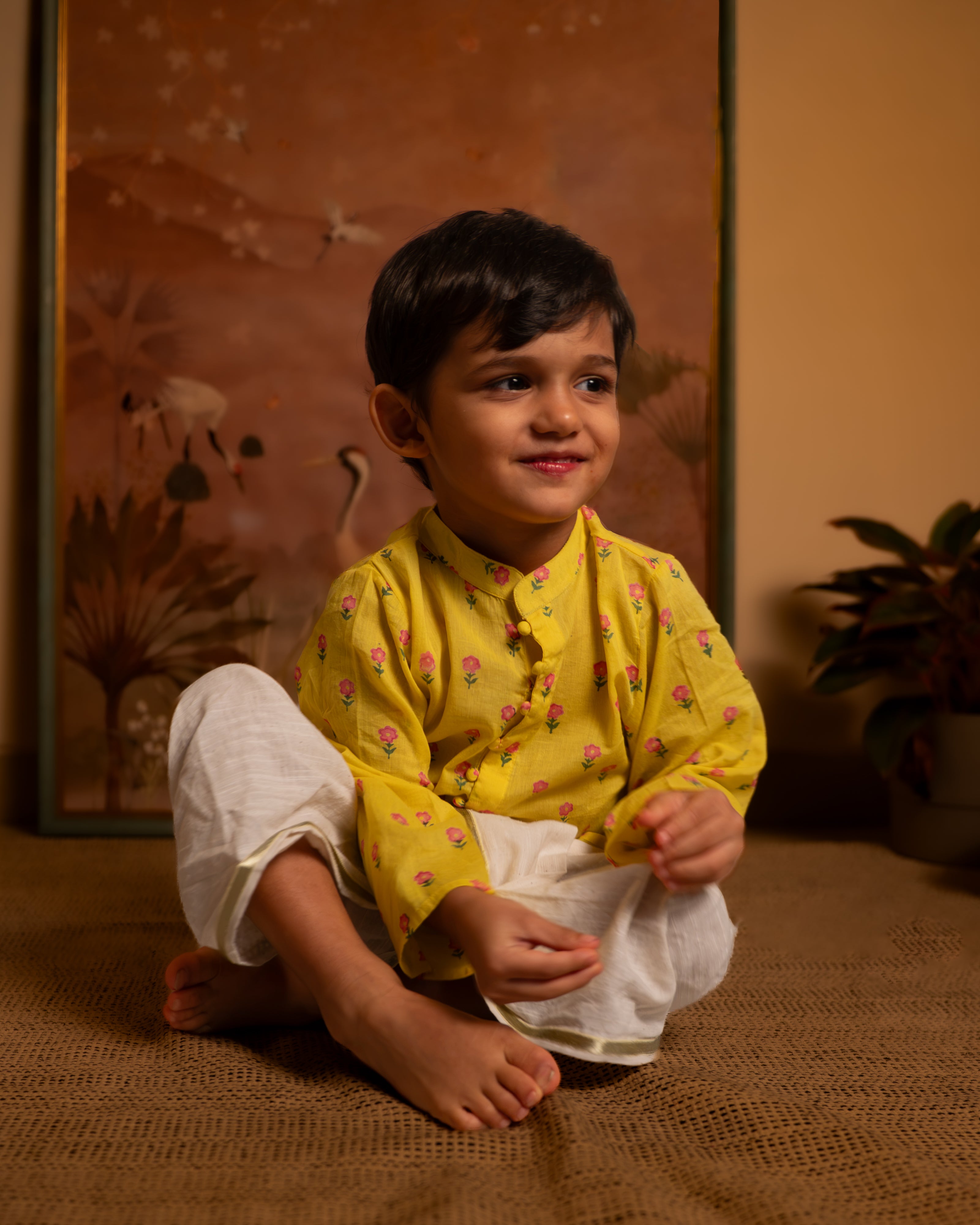 Bright festive yellow kurta with potli buttons. Beautiful floral motifs hand block printed on pure cotton.