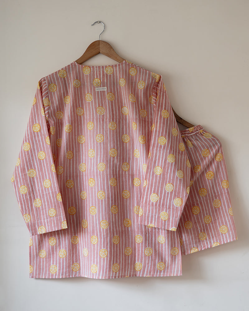 Unisex adults cotton kurta and grey shorts co ord set. Striped kurta and Shorts hand block printed by artisans in Jaipur, Rajasthan. Kurta has shell buttons and small pockets. Shorts have soft elastication and drawstring at waist for ease of wear.