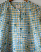 Unisex adults GOTS certified organic cotton pajama paired with blue checkered hand block printed kurta with pockets and natural shell buttons. Pajama has elastication at waist for ease of wear. Grandpa style kurta pajama set.