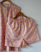 Unisex adults cotton kurta and grey shorts co ord set. Striped kurta and Shorts hand block printed by artisans in Jaipur, Rajasthan. Kurta has shell buttons and small pockets. Shorts have soft elastication and drawstring at waist for ease of wear.