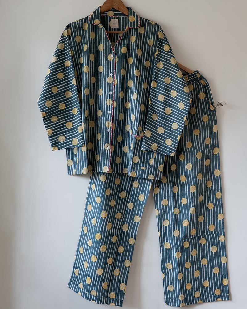 Unisex adults cotton striped shirt and pajama hand block printed with pockets and natural shell buttons. Pajama has elastication & drawstring at waist for ease of wear. Kimono style shirt & pajama set.