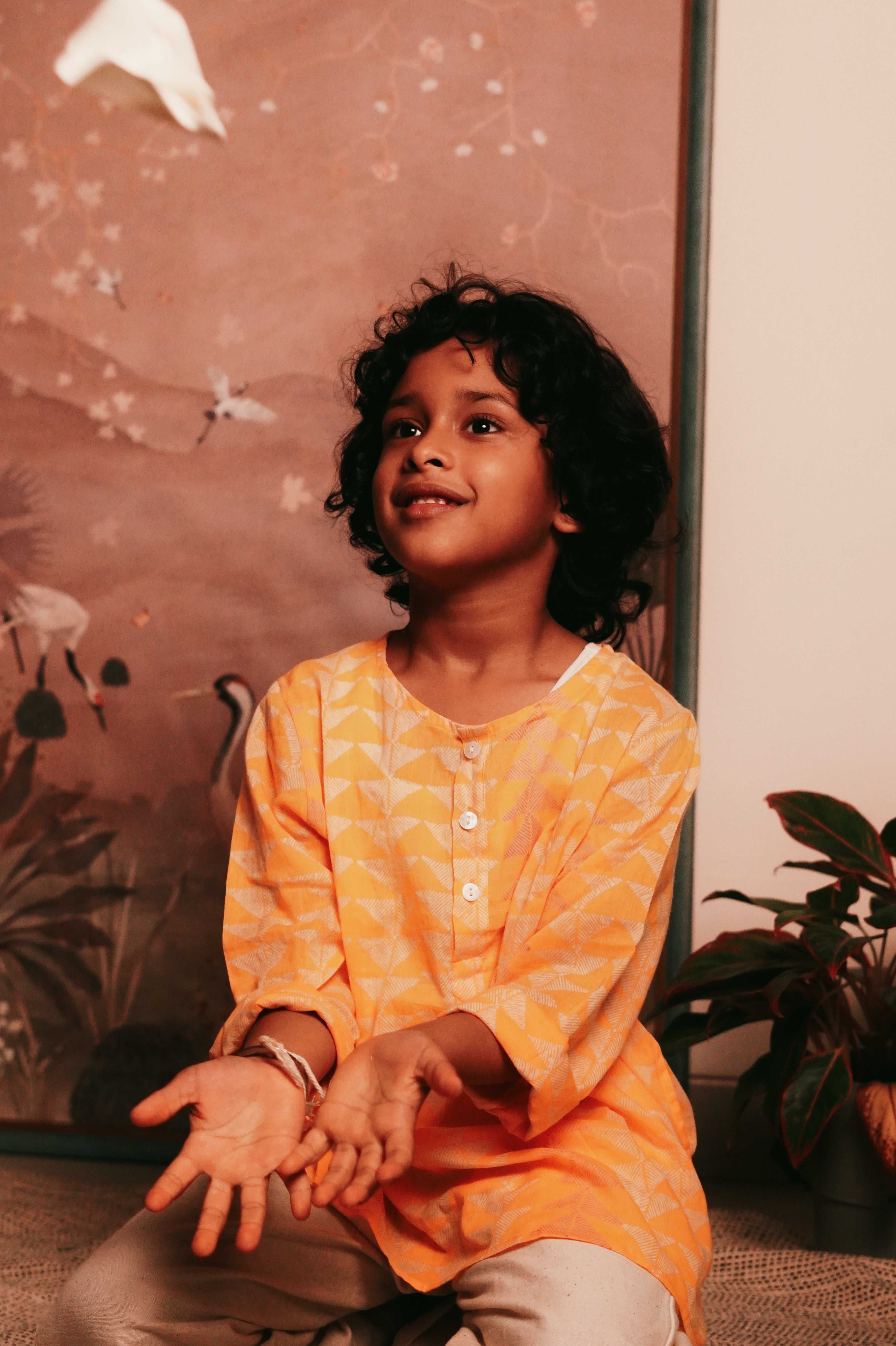 Festive yellow hand block printed kurta in triangle print. Front she'll buttons and pockets. 