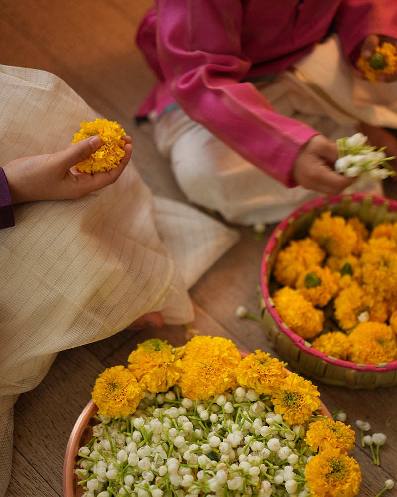 Perfect Kids silk wear, ethnic wear for kids, festive clothing for kids. Siblings love. Brother and sister celebrating diwali. Bro sis playing with flowers. 