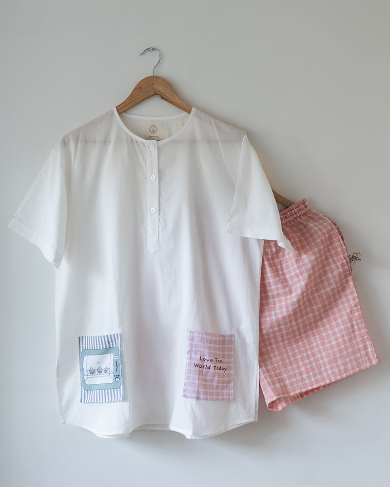 Unisex adults GOTS certified organic cotton white kurta and cotton peach shorts co ord set. 100% Cotton checkered Shorts hand block printed by artisans in Jaipur, Rajasthan. Kurta has pockets printed by hand block print. Shorts have soft elastication and drawstring at waist for ease of wear.
