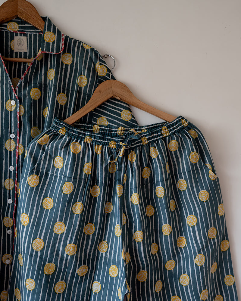 Unisex cotton striped shirt and pajama hand block printed with pockets and natural shell buttons. Pajama has elastication & drawstring at waist for ease of wear. Kimono style shirt & pajama set.