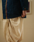 A Boy wearing a dark teal blue Indian festive Kurta with golden checks made with Handwoven cotton silk fabric woven by artisans in Maheshwar Madhya Pradesh. 