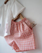 100% Cotton checkered Shorts hand block printed by artisans in Jaipur, Rajasthan. Has soft elastication at waist for ease of wear. Comes with small pockets. 