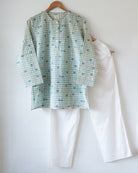 Unisex adults GOTS certified organic cotton pajama paired with blue checkered hand block printed kurta with pockets and natural shell buttons. Pajama has elastication at waist for ease of wear. Grandpa style kurta pajama set.