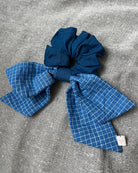 Solid blue scrunchie with blue checkered bow