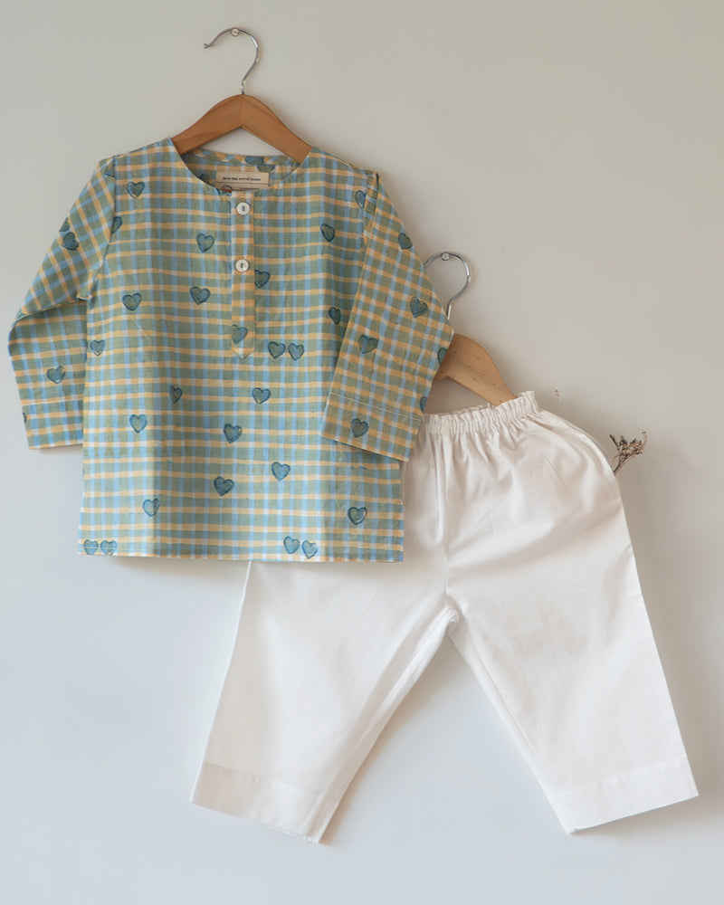 Unisex kids GOTS certified organic cotton pajama paired with blue checkered hand block printed kurta with pockets and natural shell buttons. Pajama has elastication at waist for ease of wear. Grandpa style kurta pajama set.