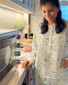 Unisex adults GOTS certified organic cotton pajama paired with blue checkered hand block printed kurta with pockets and natural shell buttons. Pajama has elastication at waist for ease of wear. Grandpa style kurta pajama set.