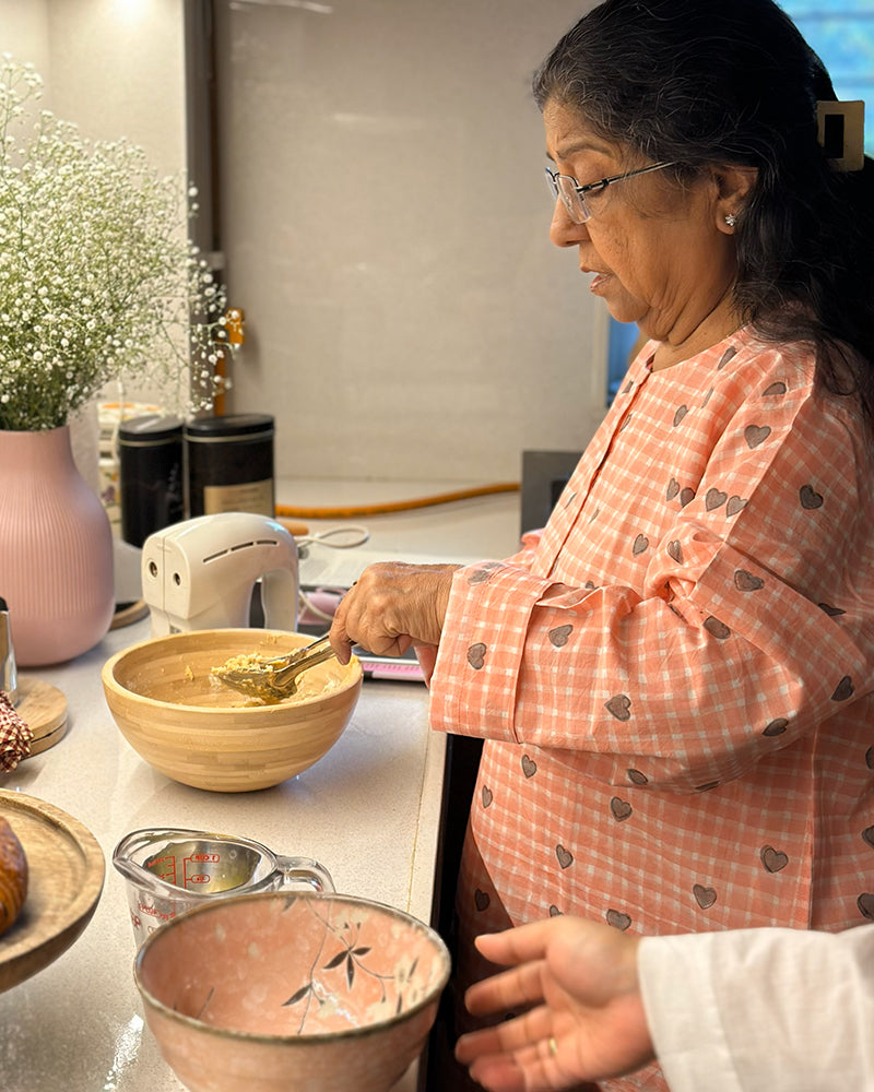 Unisex adults GOTS certified organic cotton pajama paired with peach checkered hand block printed kurta with pockets and natural shell buttons. Pajama has elastication at waist for ease of wear. Grandpa style kurta pajama set.