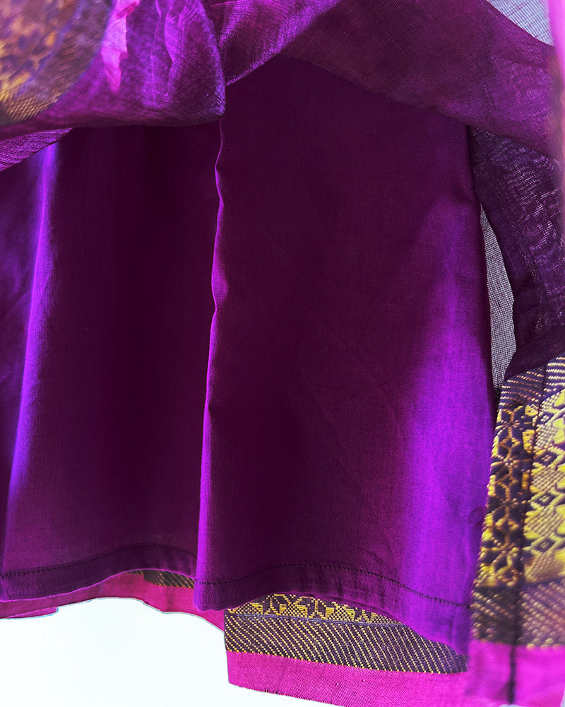 A deep purple violet sleeveless flared dress for infants in handwoven cotton silk by artisans in Maheshwar Madhya Pradesh. Perfect for festivities like Navratri, diwali, Dussehra, dushehra, bhai dooj. Infant wear. Baby ethnic wear. Silkwear for babies. Baby girl festive wear.  Silk dress with lining. 