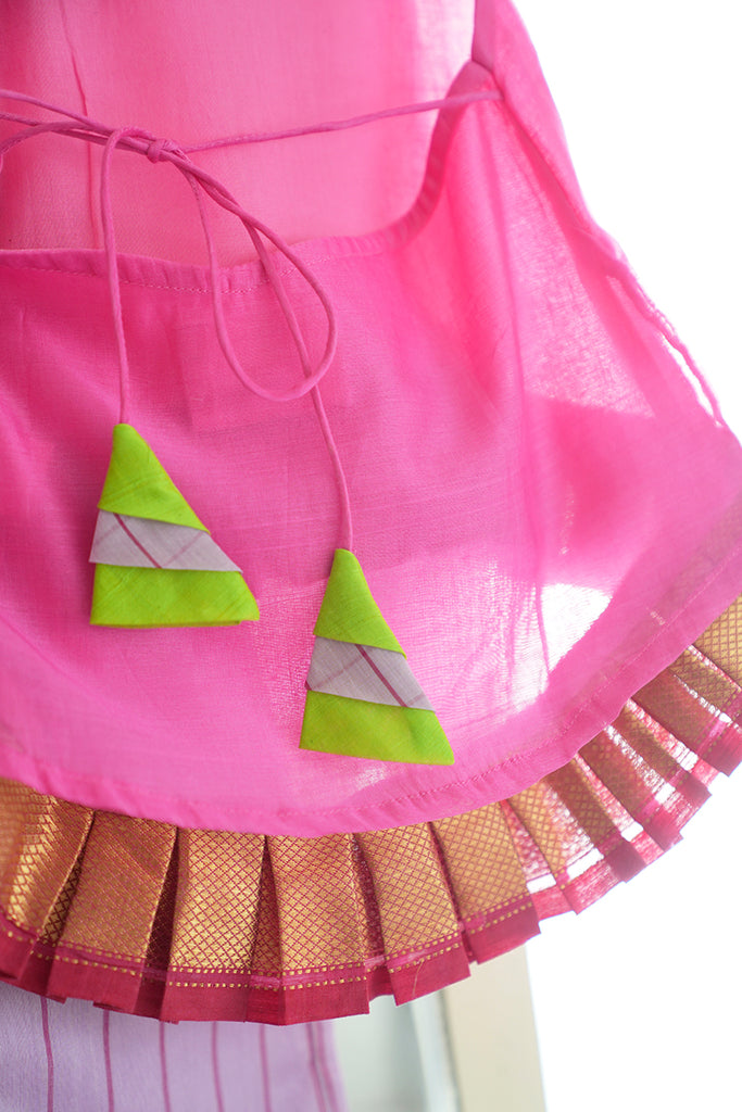 colourful tassel and zari border details on a kids pink indian outfit