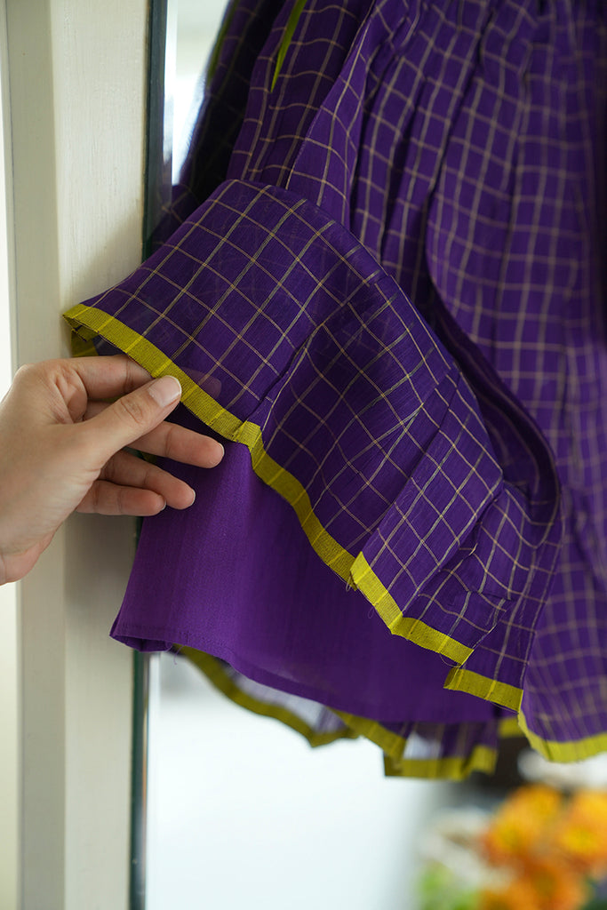 Girls lehenga skirt in purple with zari checks and a lime green selvedge with a purple lining